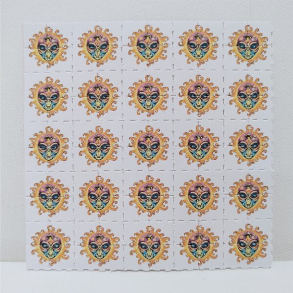 Alien sun psychedelic design on LSD Blotter – 100-tab blotter art sheet