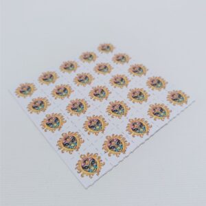 Alien sun psychedelic design on LSD Blotter – 100-tab blotter art sheet